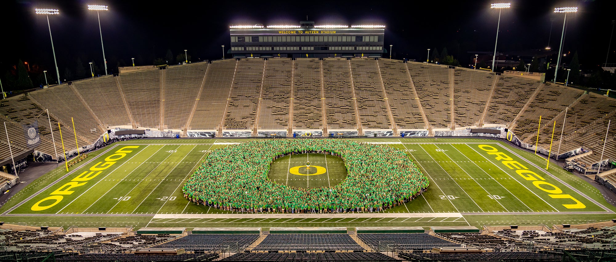 Class of 2026 forming the Oregon "O" in the middle of Autzen Stadium