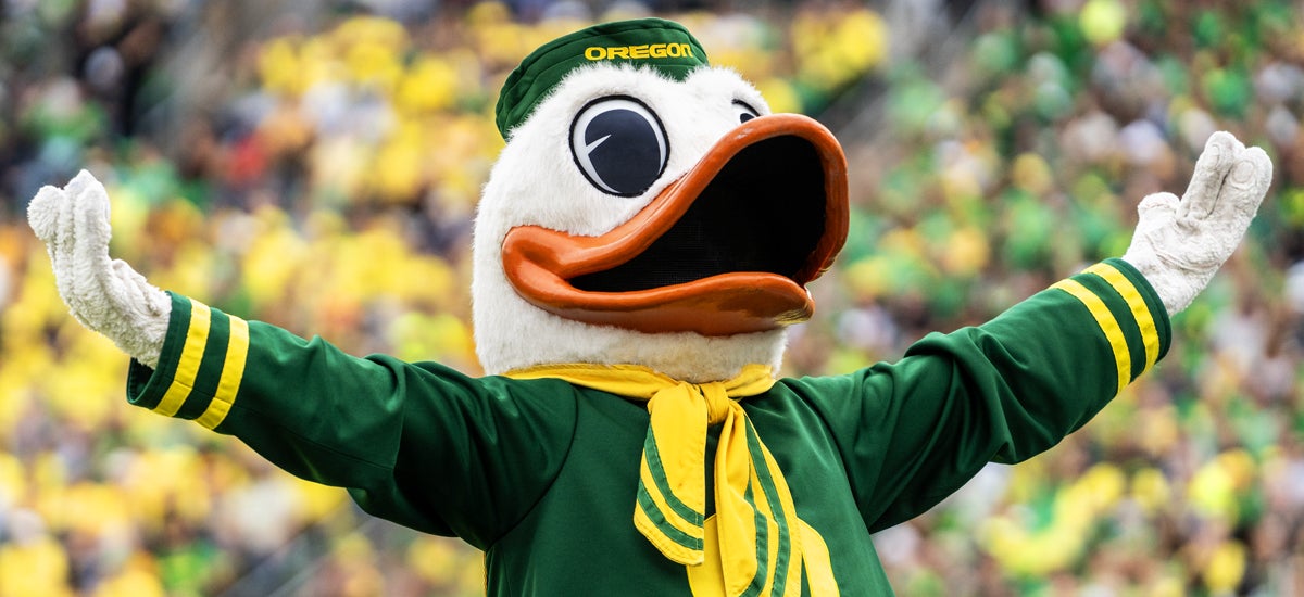 UO Duck mascot leading a crowd cheer