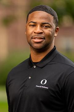 Profile photo of Dr. Rogers wearing a black UO-branded polo shirt