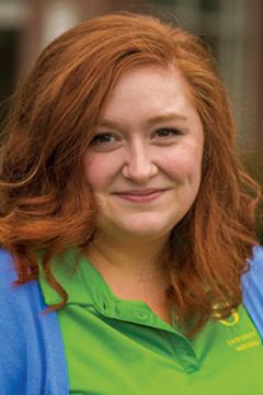Profile photo of Jessica Winders wearing a light-green UO branded polo shirt, and a light blue sweater