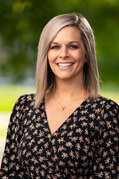 Profile photo of Melea Tejedas wearing a black floral-patterned shirt