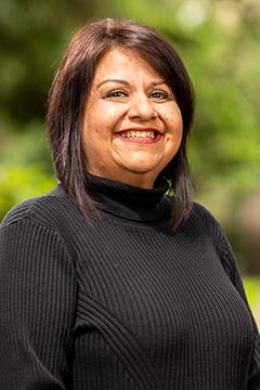 Profile photo of Ruth Rodriguez wearing a black turtle-neck sweater