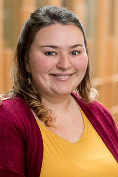 Profile photo of Shauna Harper, wearing a yellow shirt and a burgundy sweater