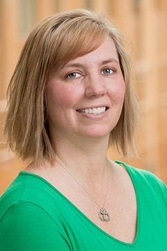 Profile photo of Staci Miles wearing a bright-green shirt